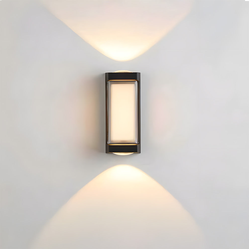 Modern wall-mounted outdoor light fixture on a gray wall