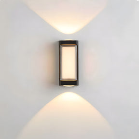 Modern wall-mounted outdoor light fixture on a gray wall