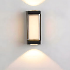 Modern outdoor wall light fixture on a gray wall