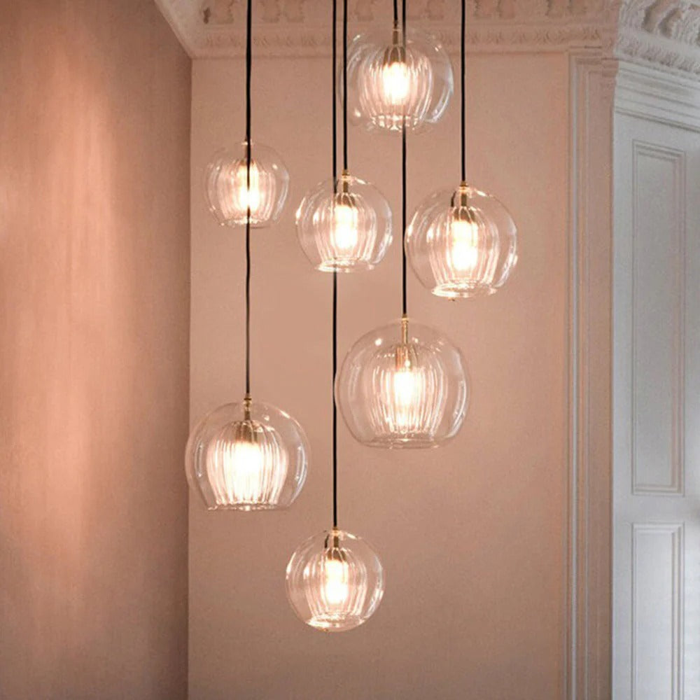 Glass globe pendant light over the island pendant lights