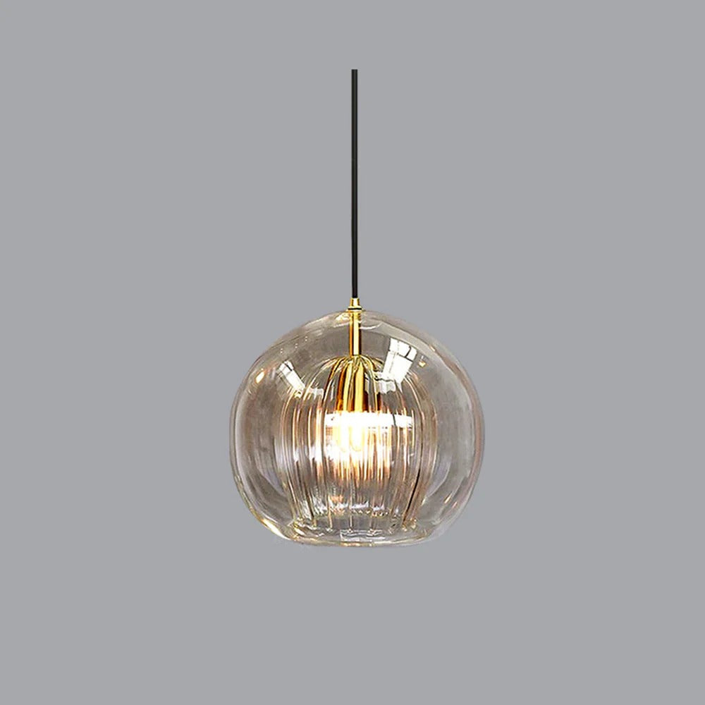 Glass globe pendant light over the island pendant lights