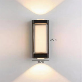 Wall-mounted outdoor light fixture with dimensions on a plain wall.
